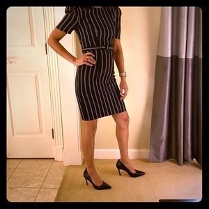 Black striped dress with cuff sleeves.